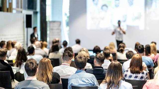 Group of people attending a conference